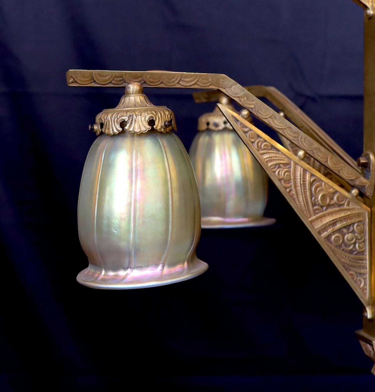 A French Art Deco Valinale de Sevres gilt bronze five light chandelier, of stylish geometric design with iridescent gold tinted glass shades, height 100cm. width 65cm